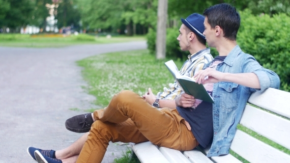 Boys Sit On Bench. One Read Book, Ask How Much Time Another Boy And Fast Leave