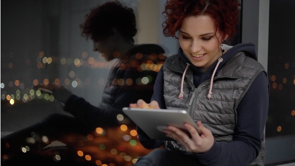 The Teenager Playing on a Tablet alt