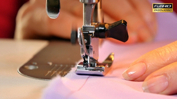 Seamstress Sews Clothes with her Sewing Machine