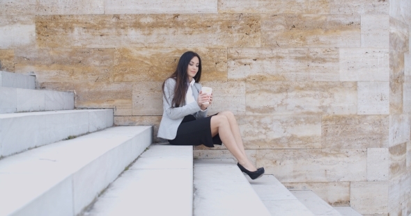 Business Woman Looking At Coffee Cup