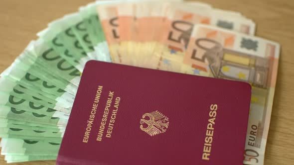 German Passport And Euro Banknotes On The Table