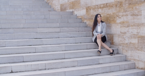 Business Woman Sitting With Crossed Legs