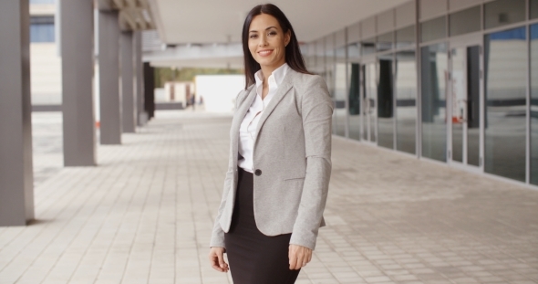 Business Woman Adjusting Her Hair Outdoors alt