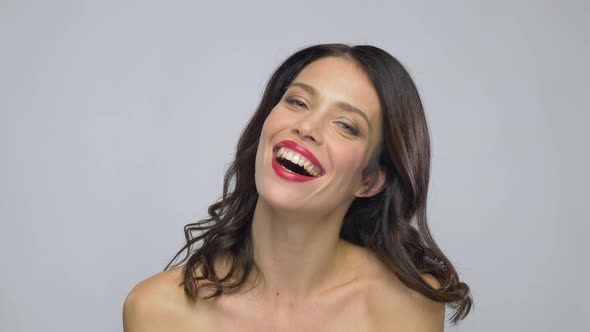 Young Woman with Red Lipstick Laughing 