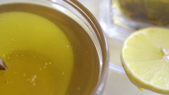 Glass Plate Filled With Honey And Lemon