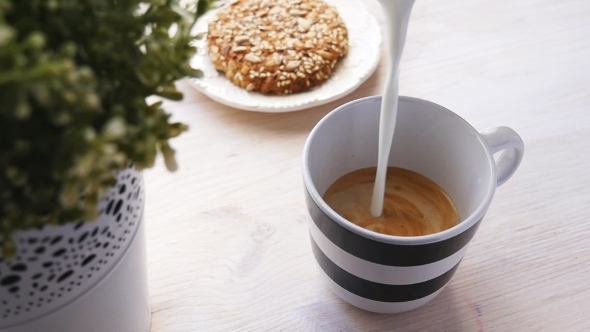 Barista Prepares Latte In a Cup 