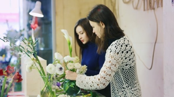 Two Florists Working In a Flower Shop