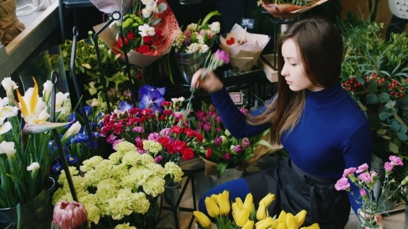 Attractive Woman Florist Make a Bouquet