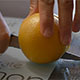 Cutting an Orange on a Chopping Board - VideoHive Item for Sale