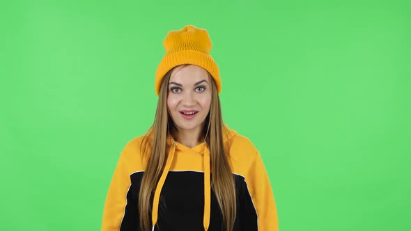 Portrait of Modern Girl in Yellow Hat in Anticipation of Worries, Then Smiling and Proud of Himself