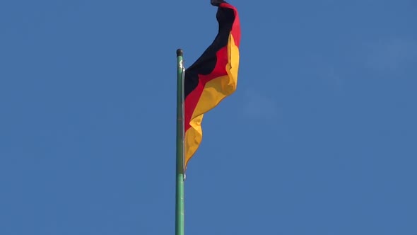 Germany Flag - Green Pole - Blue Sky