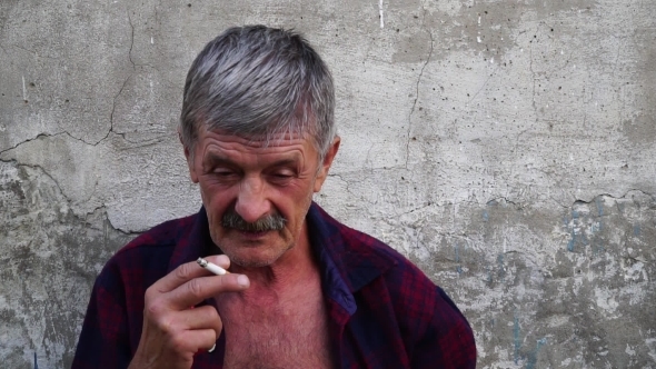  Old Man Smoking a Cigarette