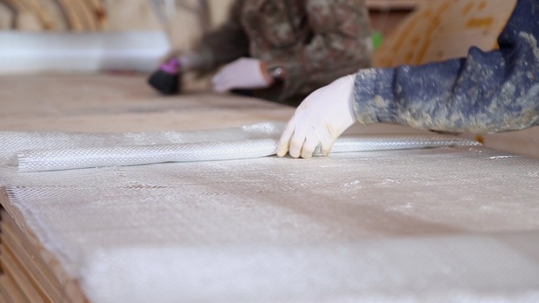 Construction of Boats at the Shipyard, Carpenters Work with Fiberglass