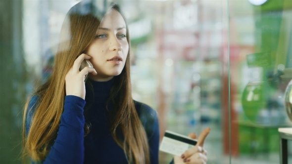 Beautiful Girl In The Glass Storefront