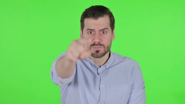 Portrait of Man Feeling Angry Fighting Green Screen
