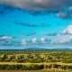Clouds Over The Green Field, Olive Trees And Sea View In a Distance - VideoHive Item for Sale