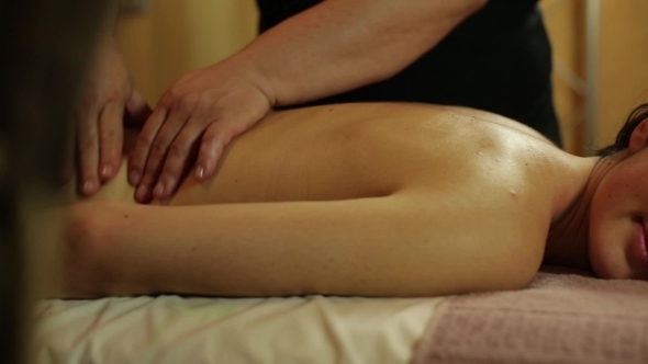 Girl Relaxes With a Massage