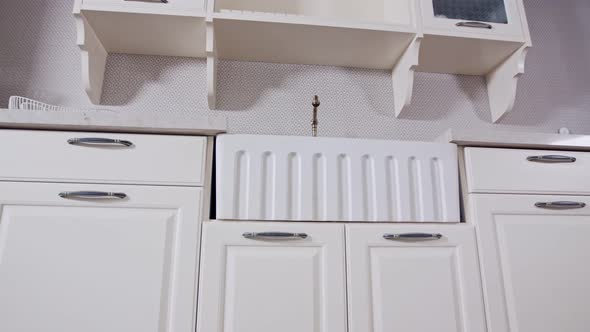 Tracking shot of a luxury kitchen with white classic design