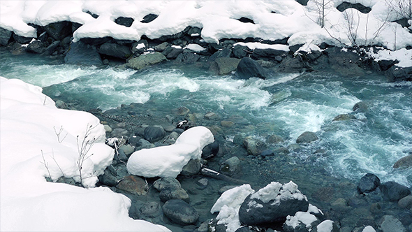Icy Blue Mountain River In The Snow
