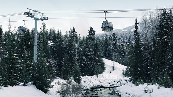 Pan Up From River To Ski Lift