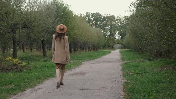 Woman in Hat and Coat