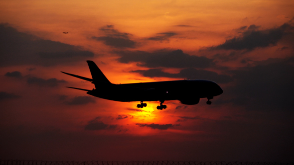 Plane In Sunset