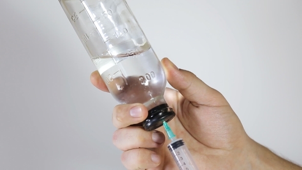 Syringe, Medical Injection In Hand