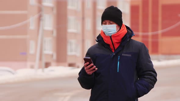 Closeup of a Man in Medical Mask Talking Online Video Chat