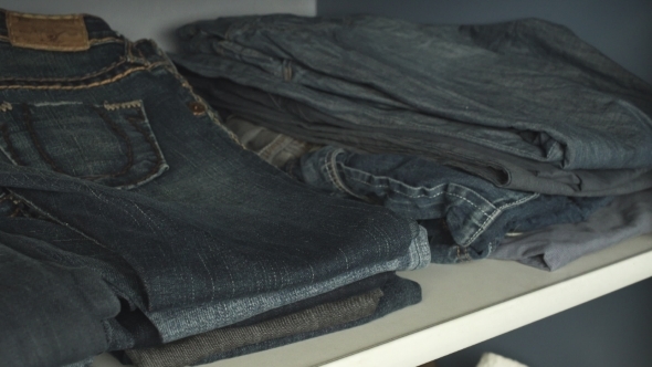 Shelf With Jeans In The Closet