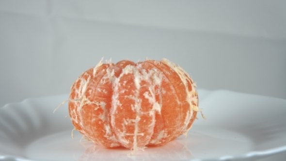 Mandarin Without Skin, Turns On a Plate.