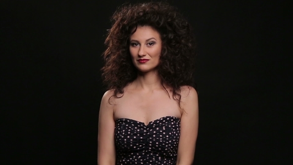 Young Brunette With Long Brown Curly Hair Dancing 