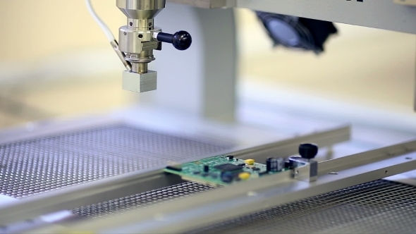 Surface Mount Technology Machine Places Elements on Circuit Boards