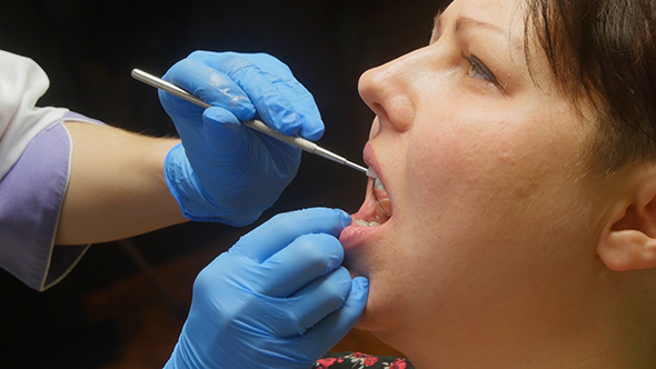 Patient Having Her Teeth Examined