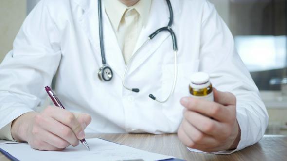 Doctor Prescribing Medication or Drug In Hospital