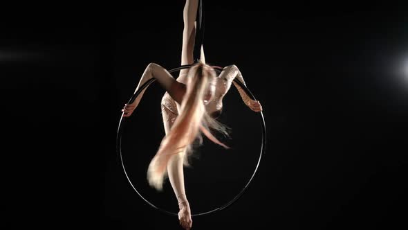 Wide Shot Aerial Gymnast in Split on Air Hoop Spinning Shaking Long Hair