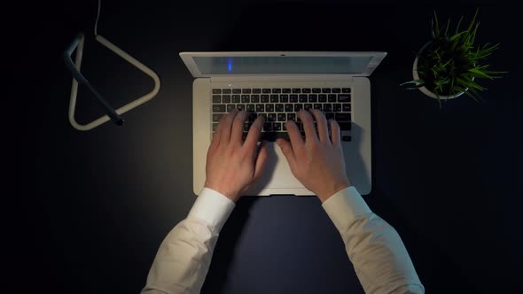 Male Businessman Turns Off the Laptop Takes Off His Glasses and Turns Off the Light