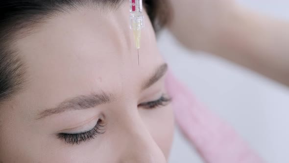 Closeup of Woman's Face Having Botox Injection in Salon