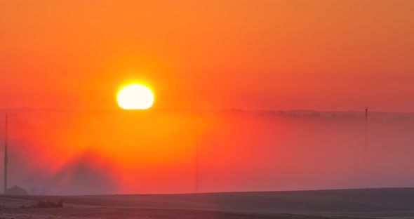 Time Lapse of Red Sunrise Over Fog in the Morning