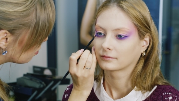 An Attractive Girl Doing Makeup