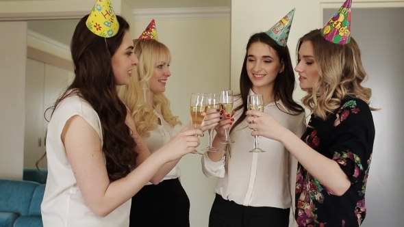 Young Beautiful Girls Celebrating Birthday With Glasses Of Champagne