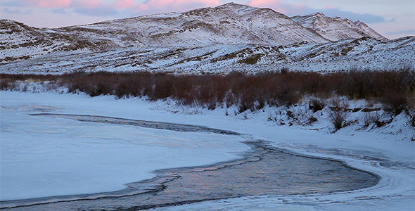 Frozen Mountain River at Sunset