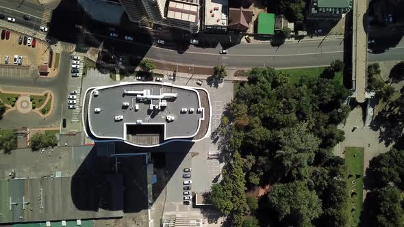 Aerial City View with Crossroads and Roads, Houses, Buildings, and Parking Lots