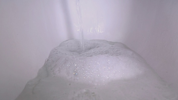 Pouring Water and Foam is Formed
