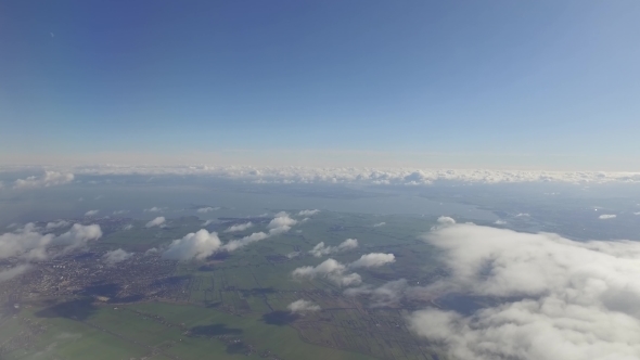 The Airplane Is Flying Above The Clouds