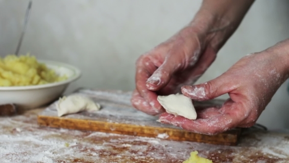 Woman Sculpts Dumplings At Home Kitchen