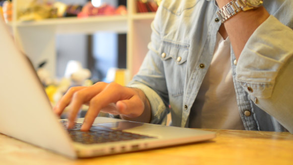 Relax Man Working on Laptop in Office alt