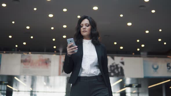 Businesswoman with a Smartphone in Her Hands