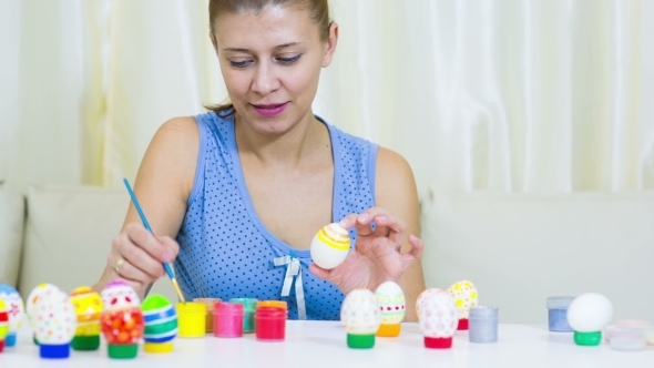 Woman Painting Easter Egg
