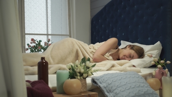 Girl Wakes Up And Is Hiding Under The Covers.