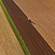 Aerial Footage of a Tractor on a Field - VideoHive Item for Sale